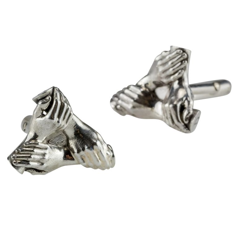 A pair of silver cufflinks of 3 siblings hands linked together