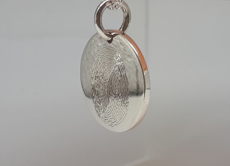 Sterling silver charm hand engraved with fingerprint