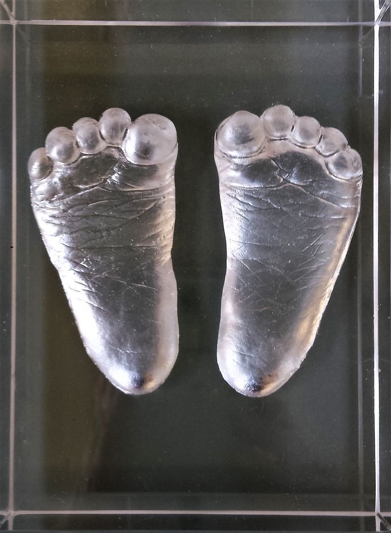 Glass plaque with baby feet impressions