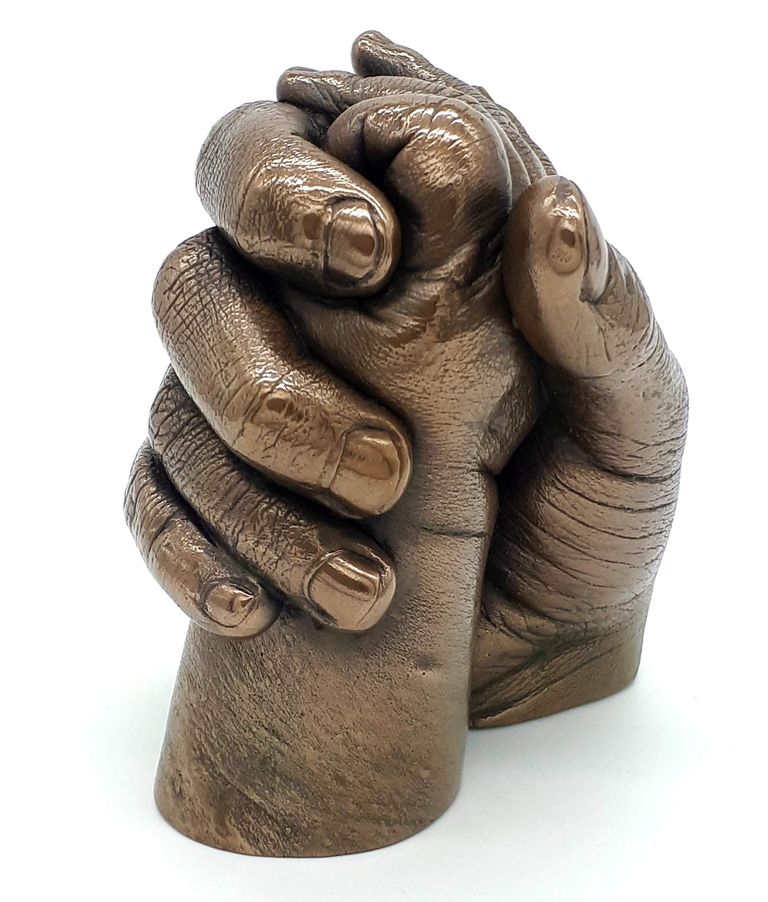 Adult and baby cast in bronze resin showing the mum gently holding the baby's arm