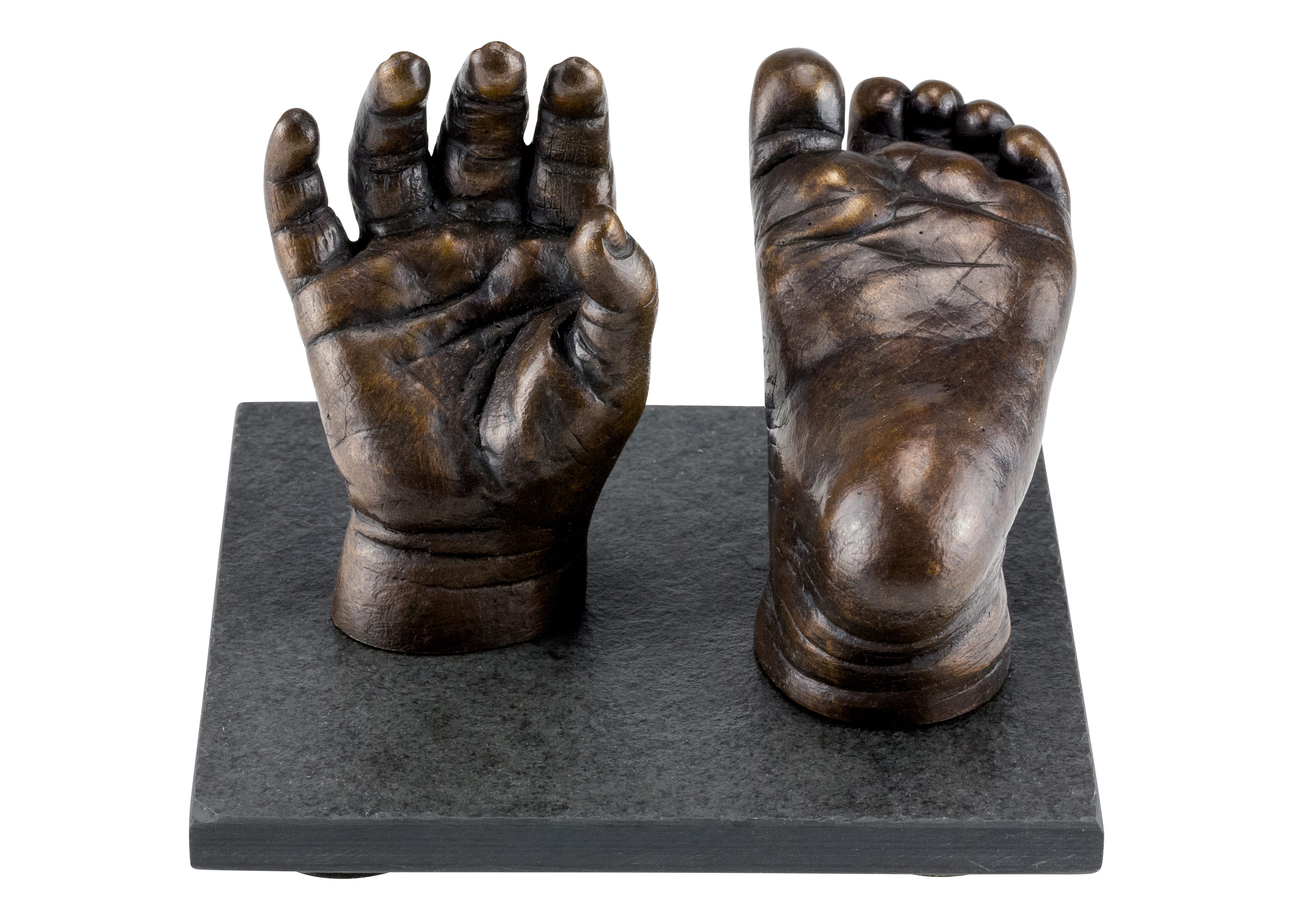 Dark patina real bronze baby hand and foot set on a slate square and showing the palm of the hand and sole of the foot