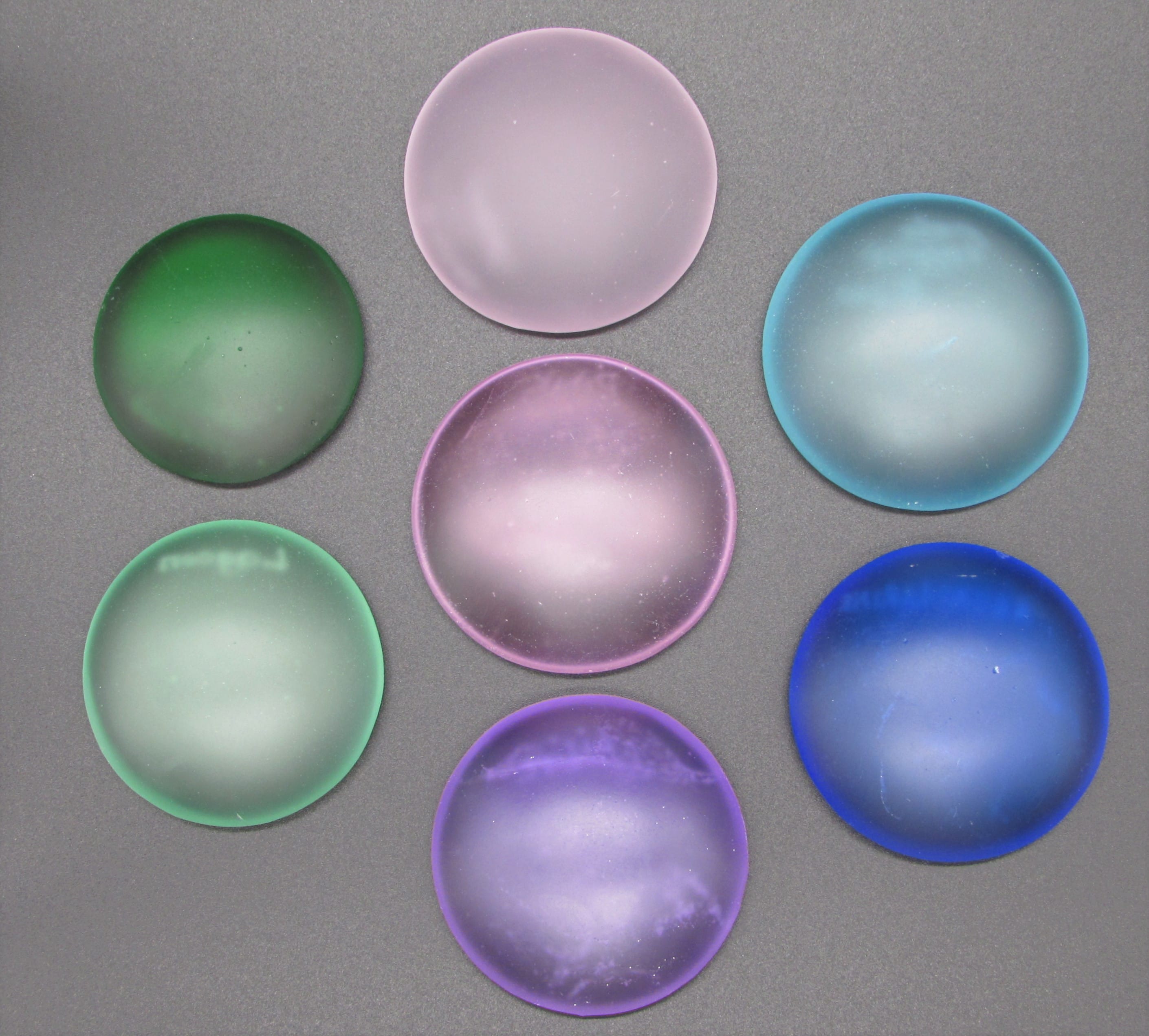 Seven circles of glass to show a sample of colours available